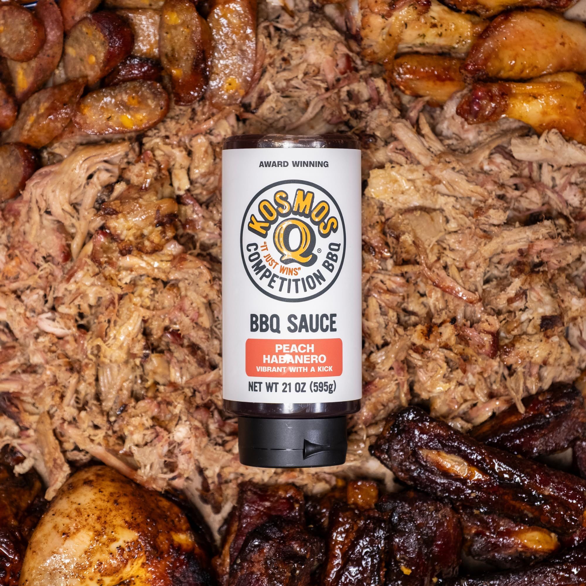 Kosmos Q wings dipped from bottle showing convenience and bold flavor