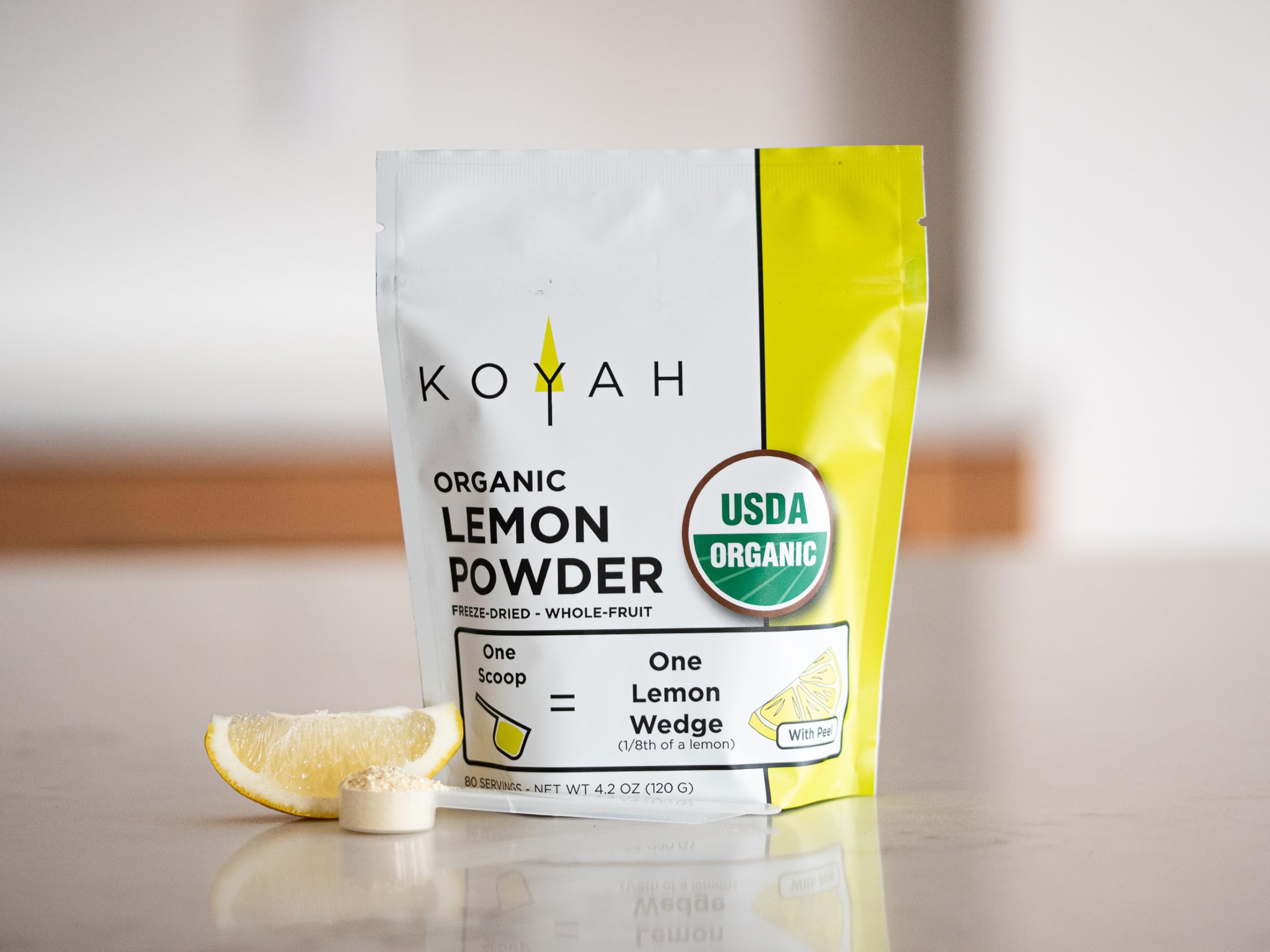 KOYAH powdered lemon added to salad dressing showcasing convenience in kitchen