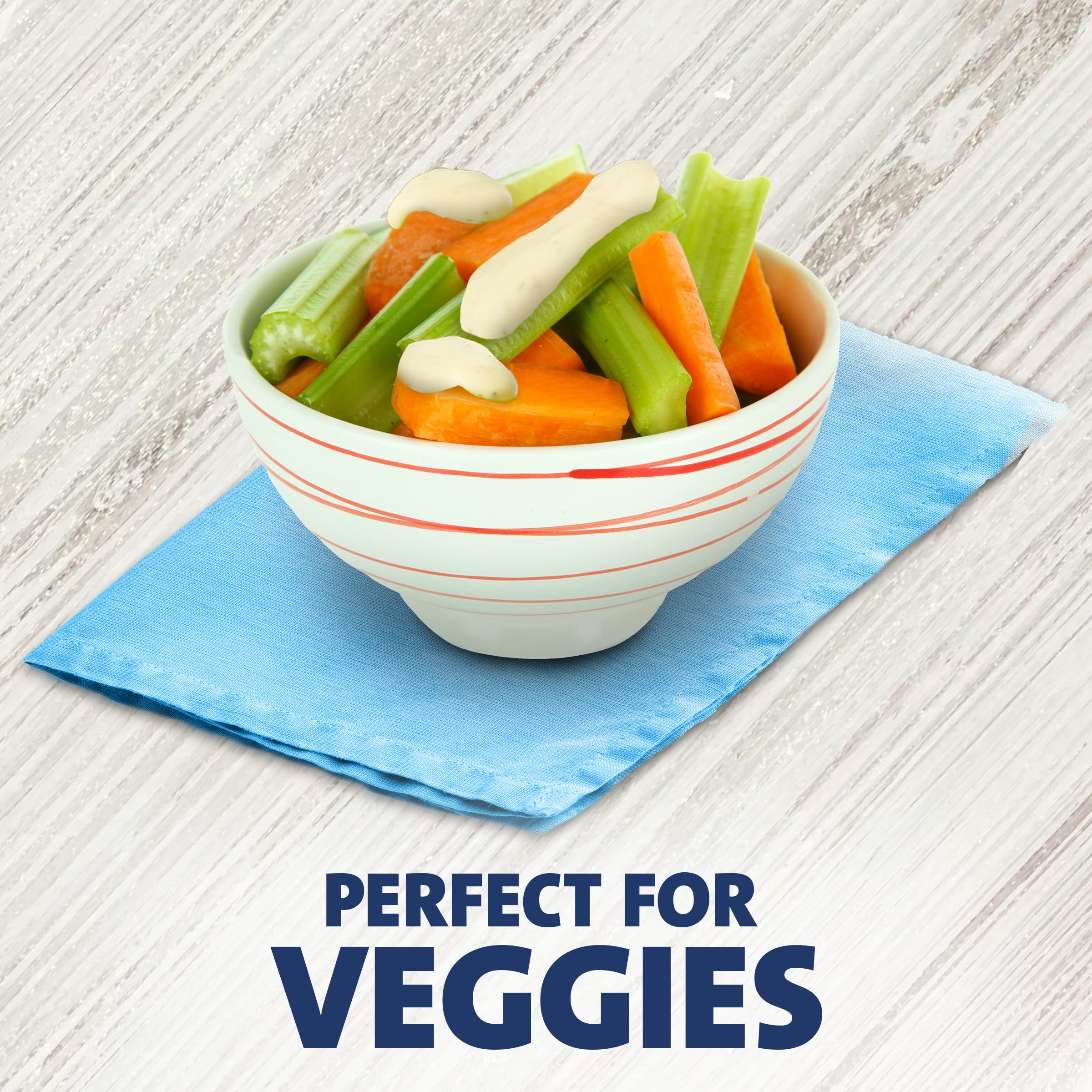 Good Seasons Kraft packet atop a salad showing easy dressing application and presentation