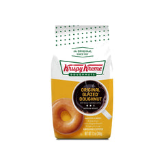 Krispy Kreme ground coffee on spoon demonstrating grind consistency and ease
