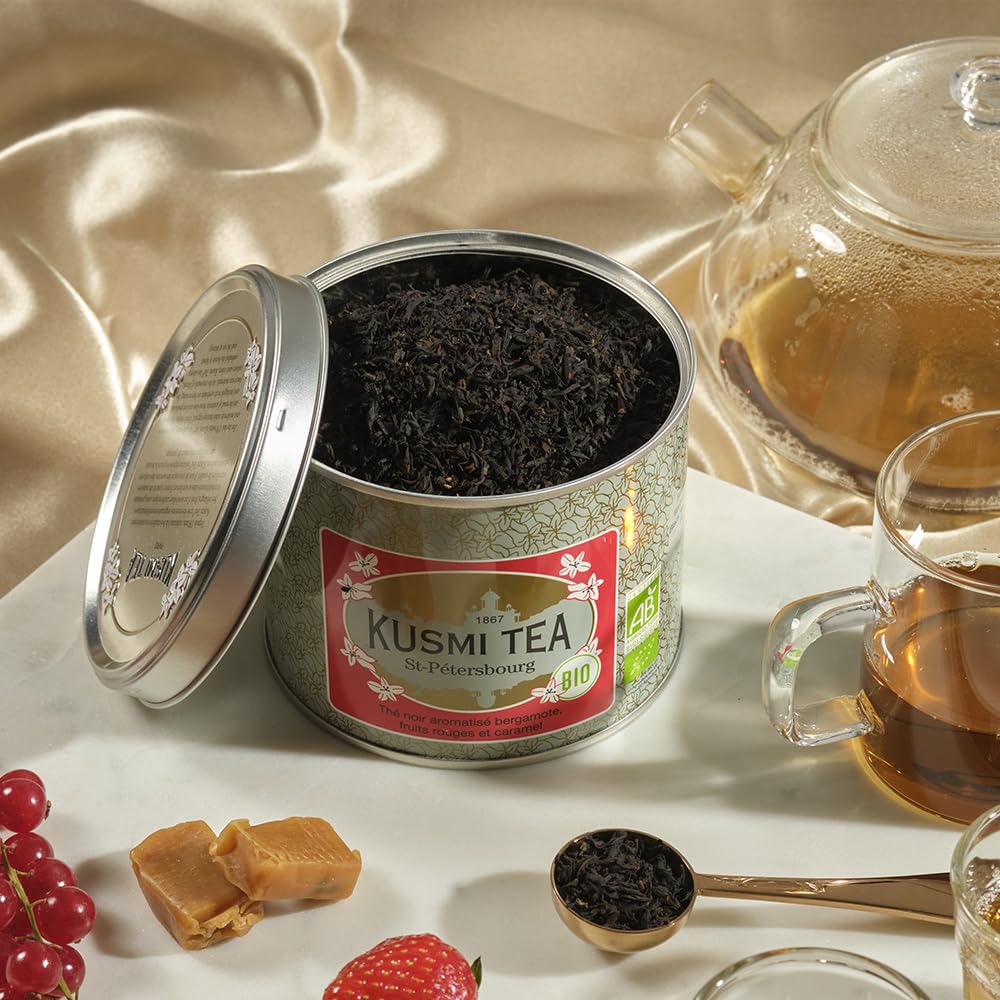 Kusmi Tea opened tin revealing loose-leaf blend, emphasizes freshness and refillable packaging