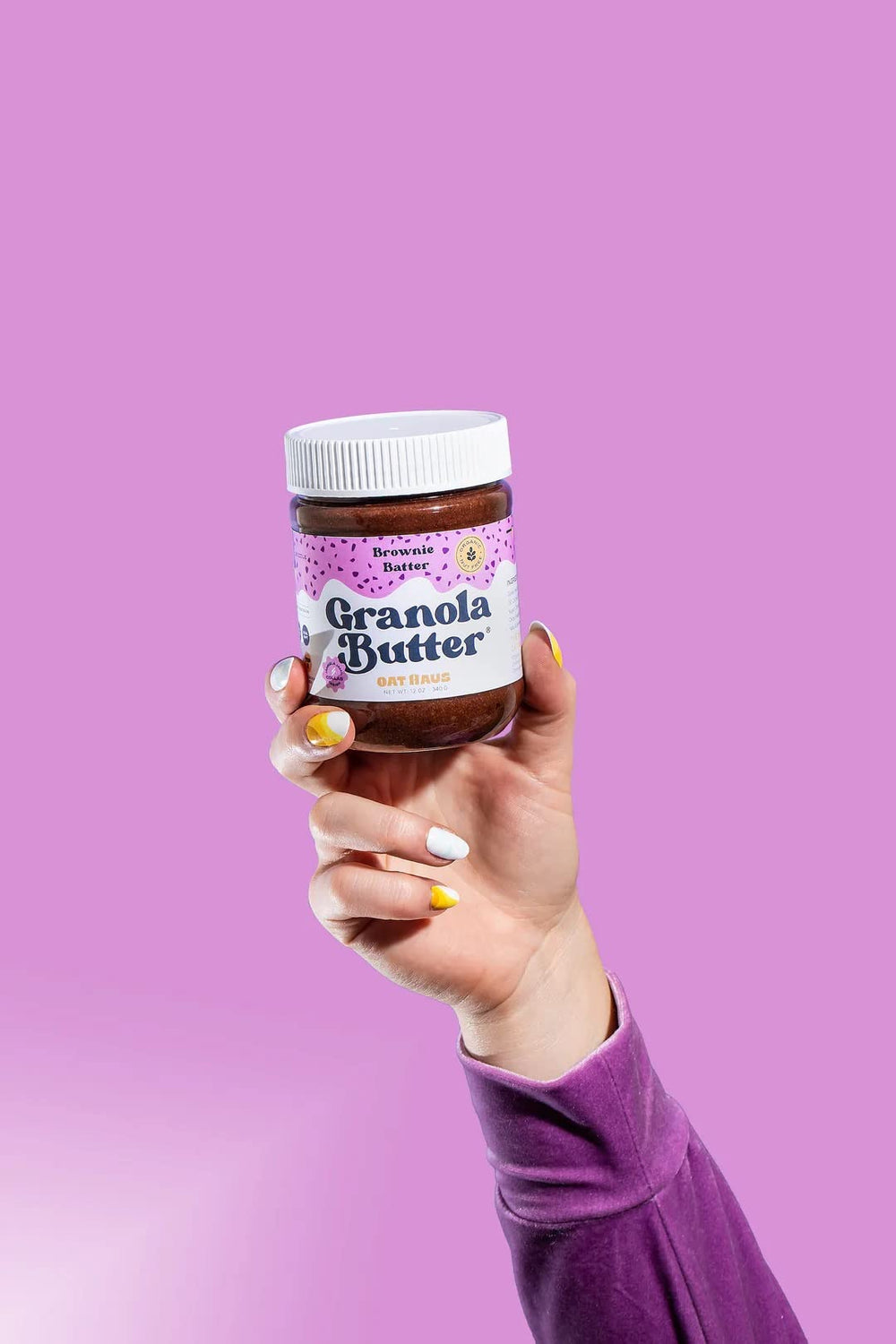 KWEEN jar next to spoon for size comparison showing portion-friendly jar