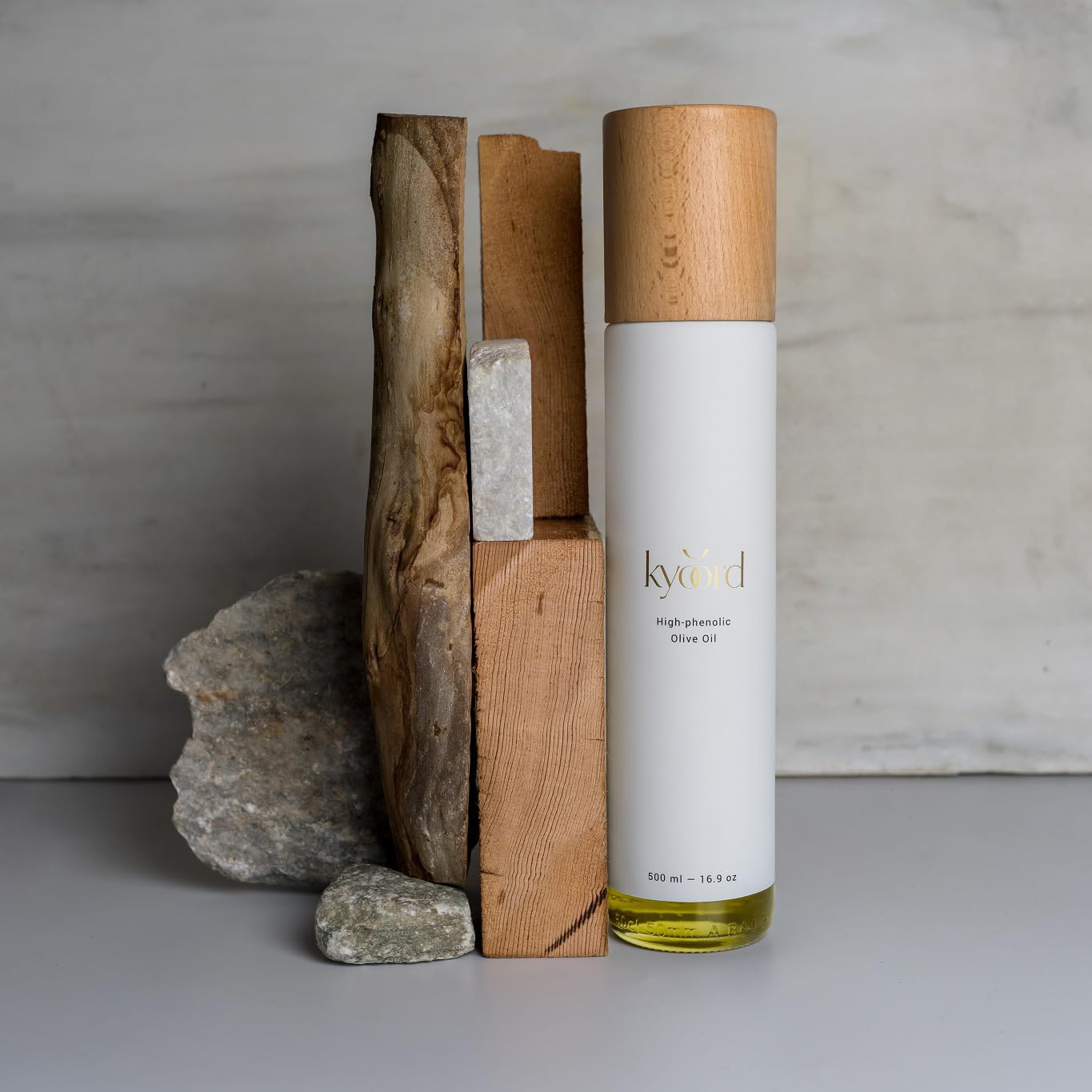 kyoord olive press and early-harvest olives highlighting artisanal production benefit