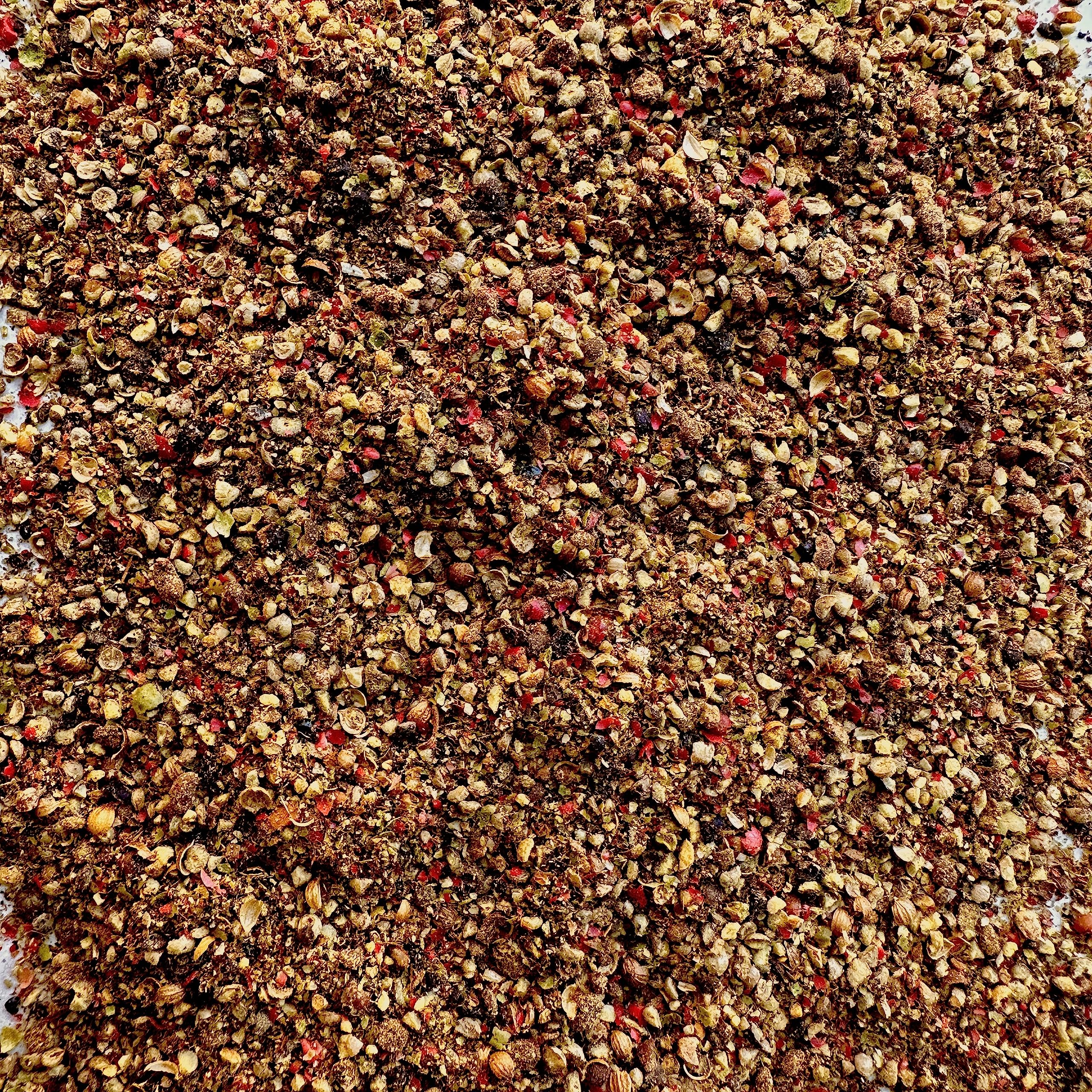 close-up of mixed peppercorns texture with La Boite for bold crunchy finish