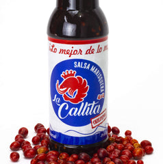 SALSA MARISQUERA LA CALLITA 5 oz bottle held in hand showing convenient travel-friendly size