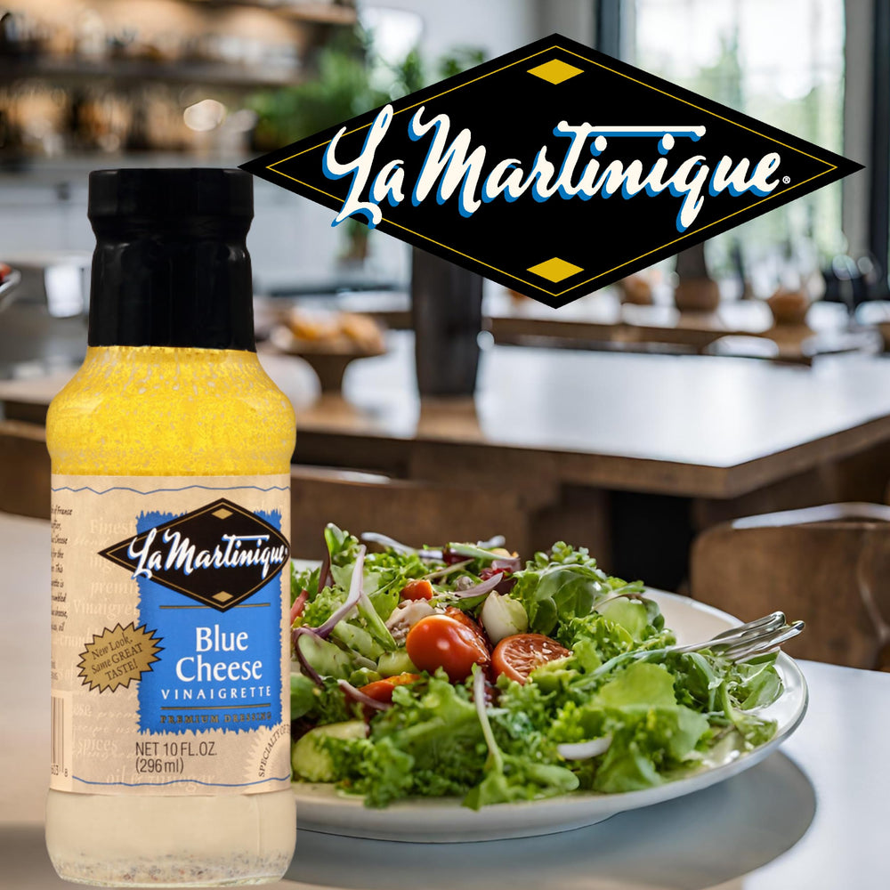 Hand holding La Martinique 10 oz bottle showing compact kitchen-ready size