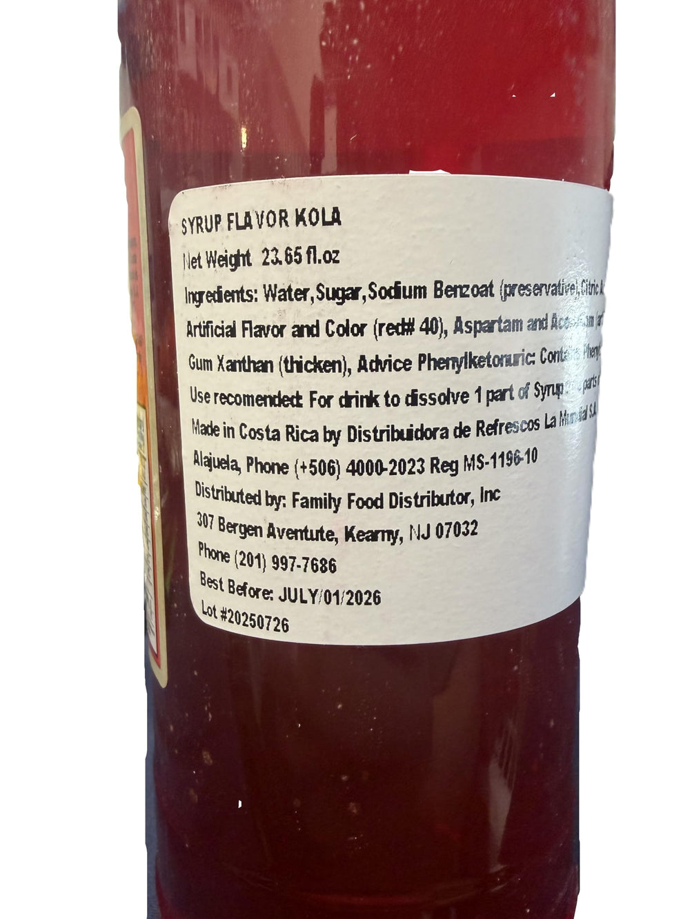 La Mundial syrup in kitchen beside desserts and glasses showing versatile use benefit