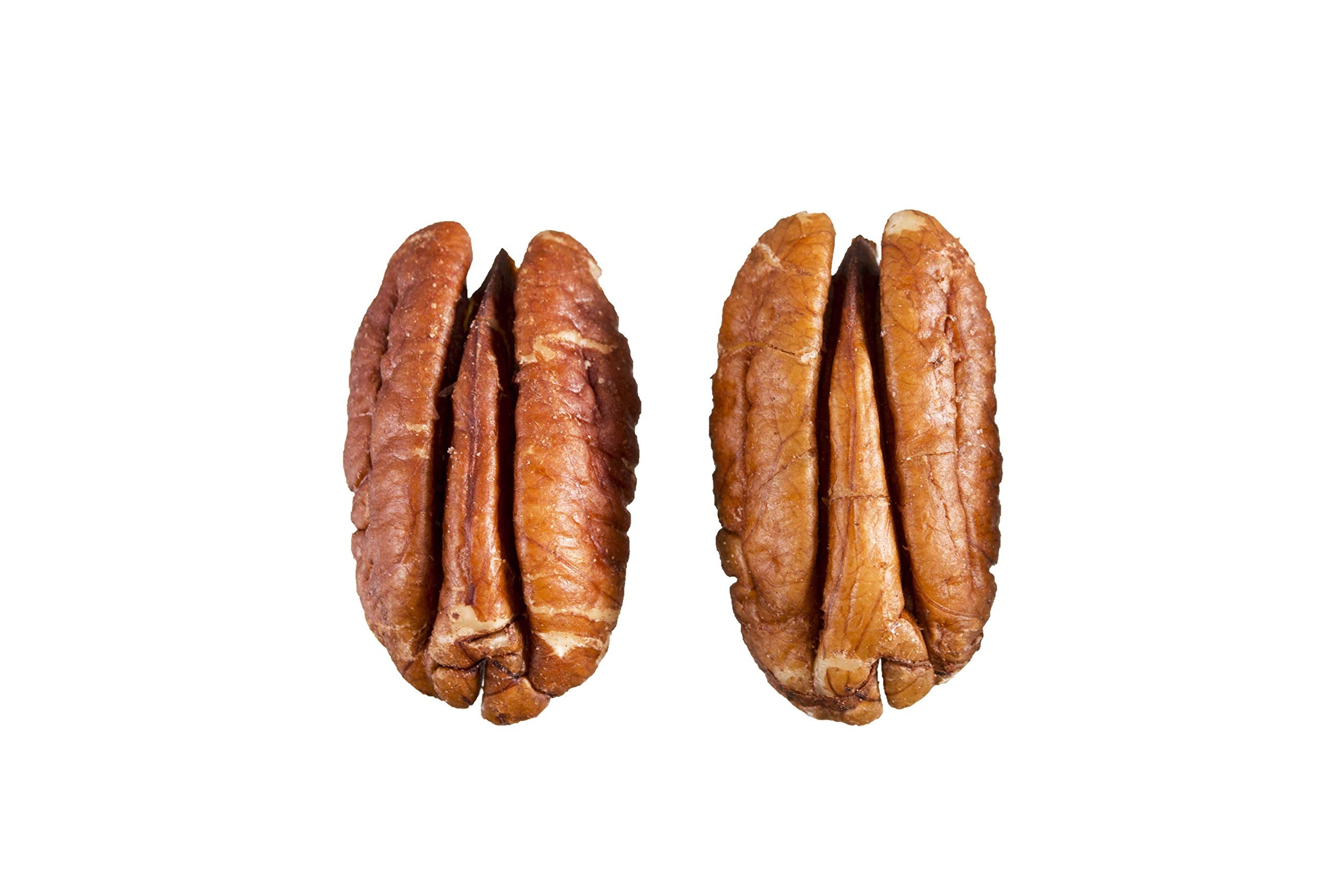 Grupo La Nogalera pecan halves spread on a baking sheet for even roasting