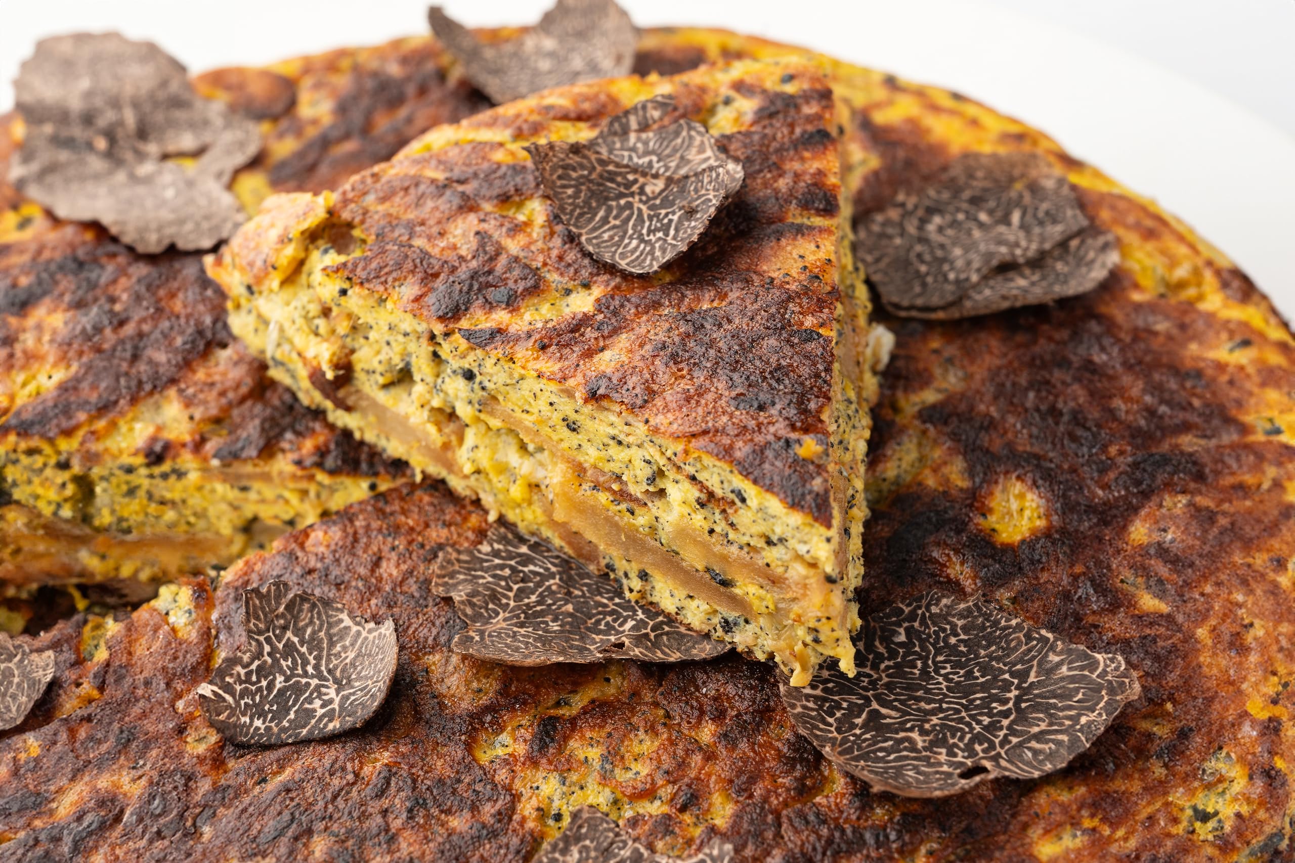 La Rustichella texture close-up showing mushroom and truffle pieces for depth
