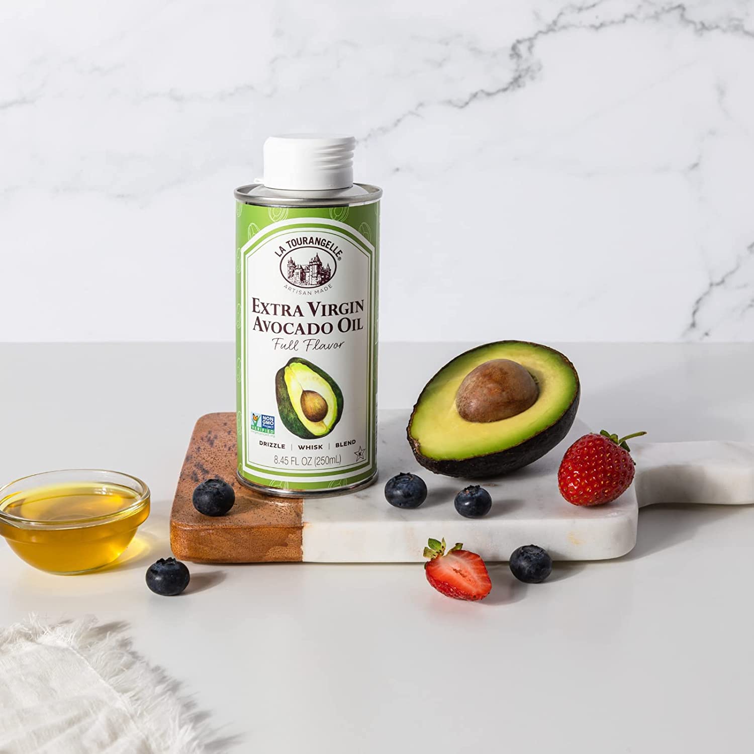 La Tourangelle bottle beside fresh avocados showing ingredient source benefit: natural origin
