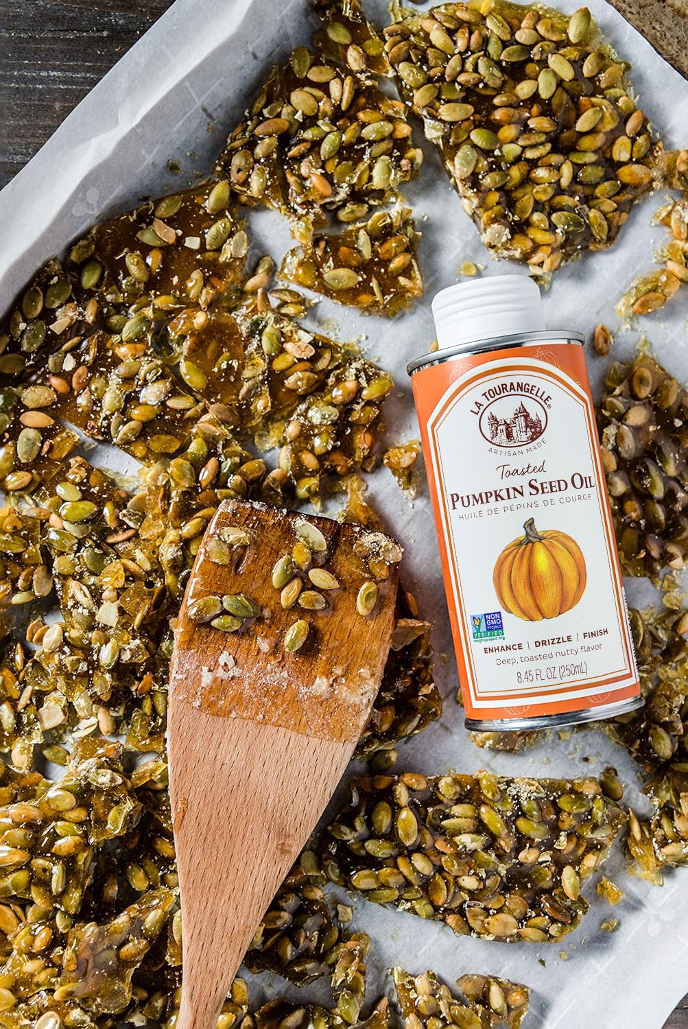 La Tourangelle bottle beside pumpkin seeds showing natural ingredients
