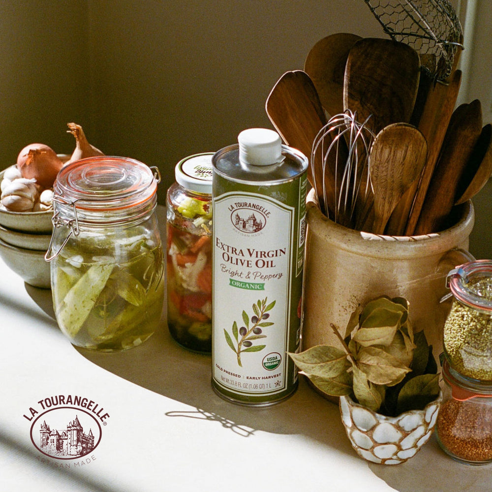 La Tourangelle bottle next to measuring cup showing 33.8 fl oz size and pantry fit