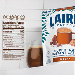 Prepared mocha latte in a ceramic mug made from Laird Superfood instant mix showcasing creamy foam and drink appeal
