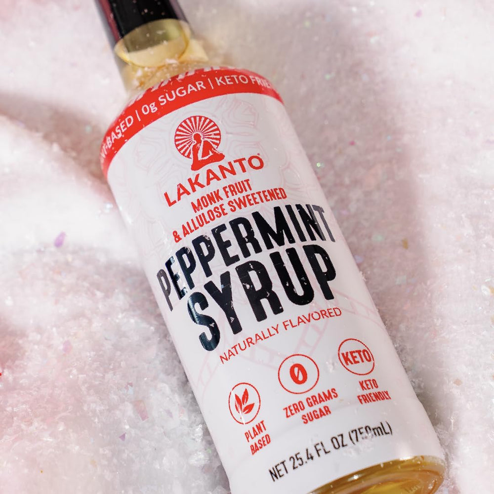 Lakanto peppermint bottle next to measuring cup to show 25.4 fl oz scale