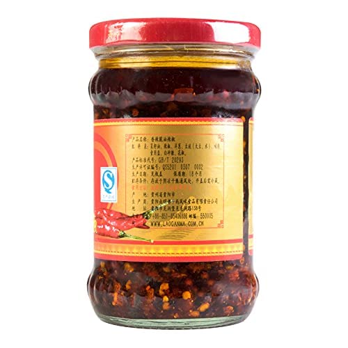 LAO GAN MA jar with NineChef spoon beside it demonstrating tidy scooping and portion control