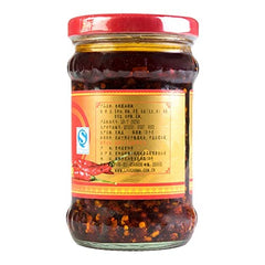 LAO GAN MA jar with NineChef spoon beside it demonstrating tidy scooping and portion control