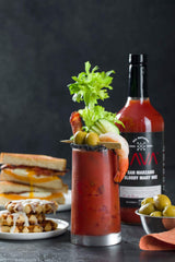 LAVA bottle beside made Bloody Mary being poured, showing quick cocktail prep benefit