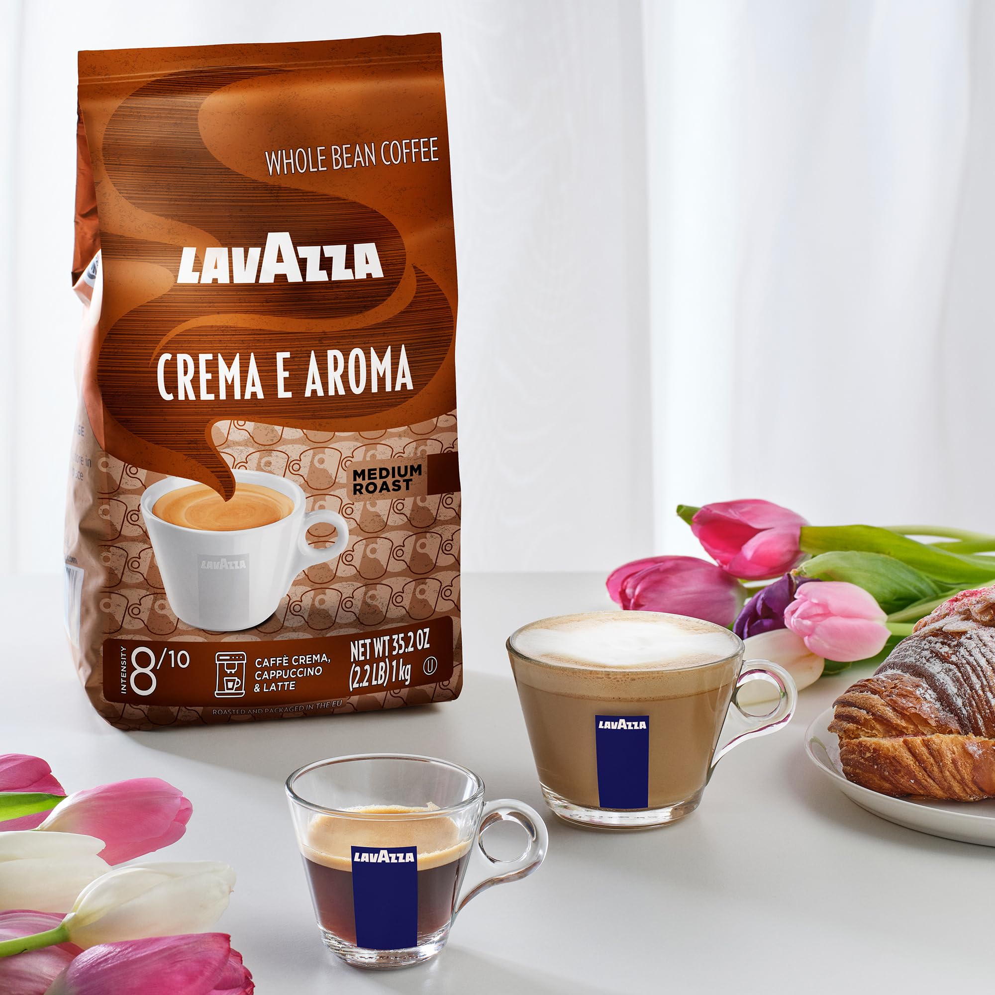 Lavazza bag held in hand to show 2.2 lb scale for quantity perspective