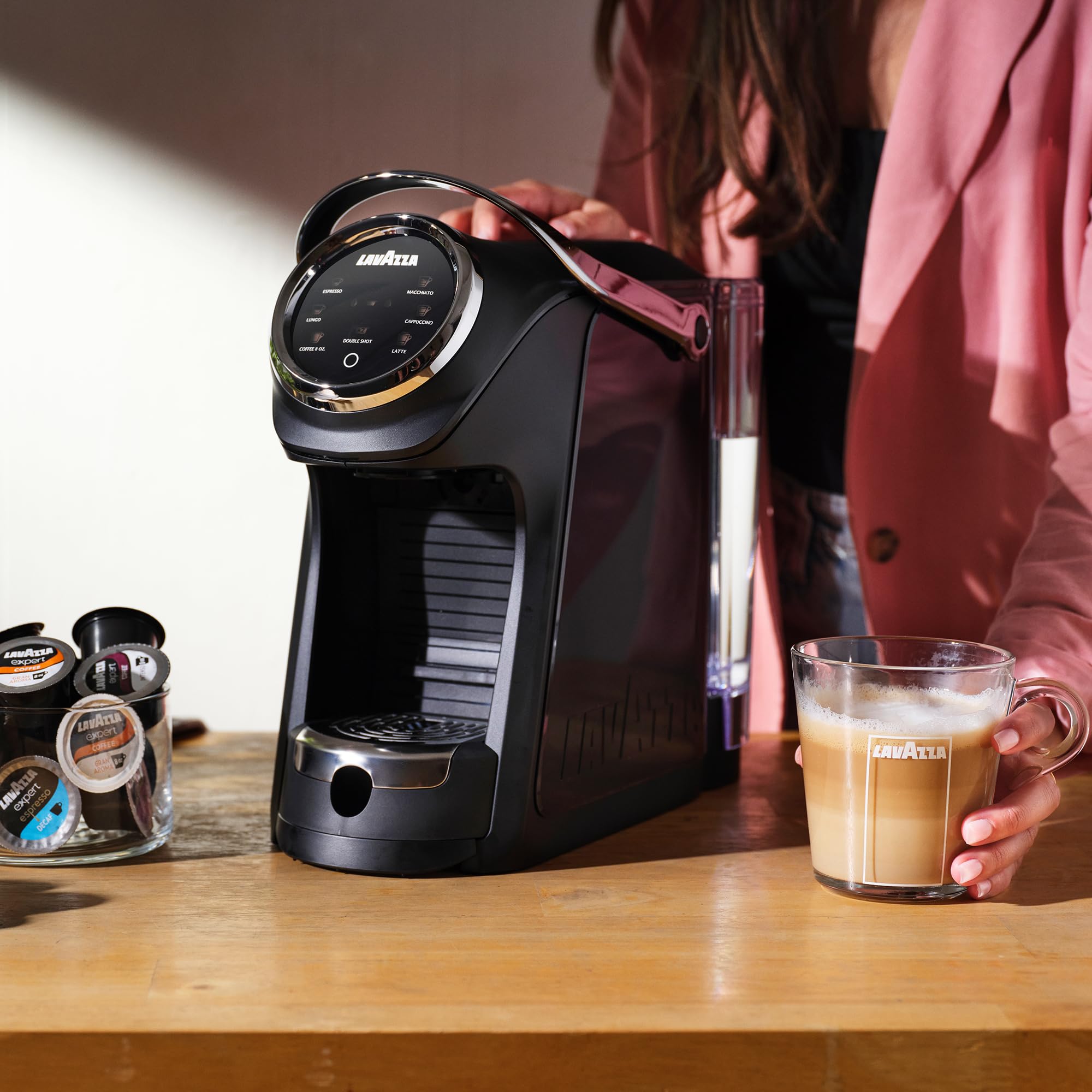 Lavazza capsule used in a modern kitchen setting conveying everyday household enjoyment