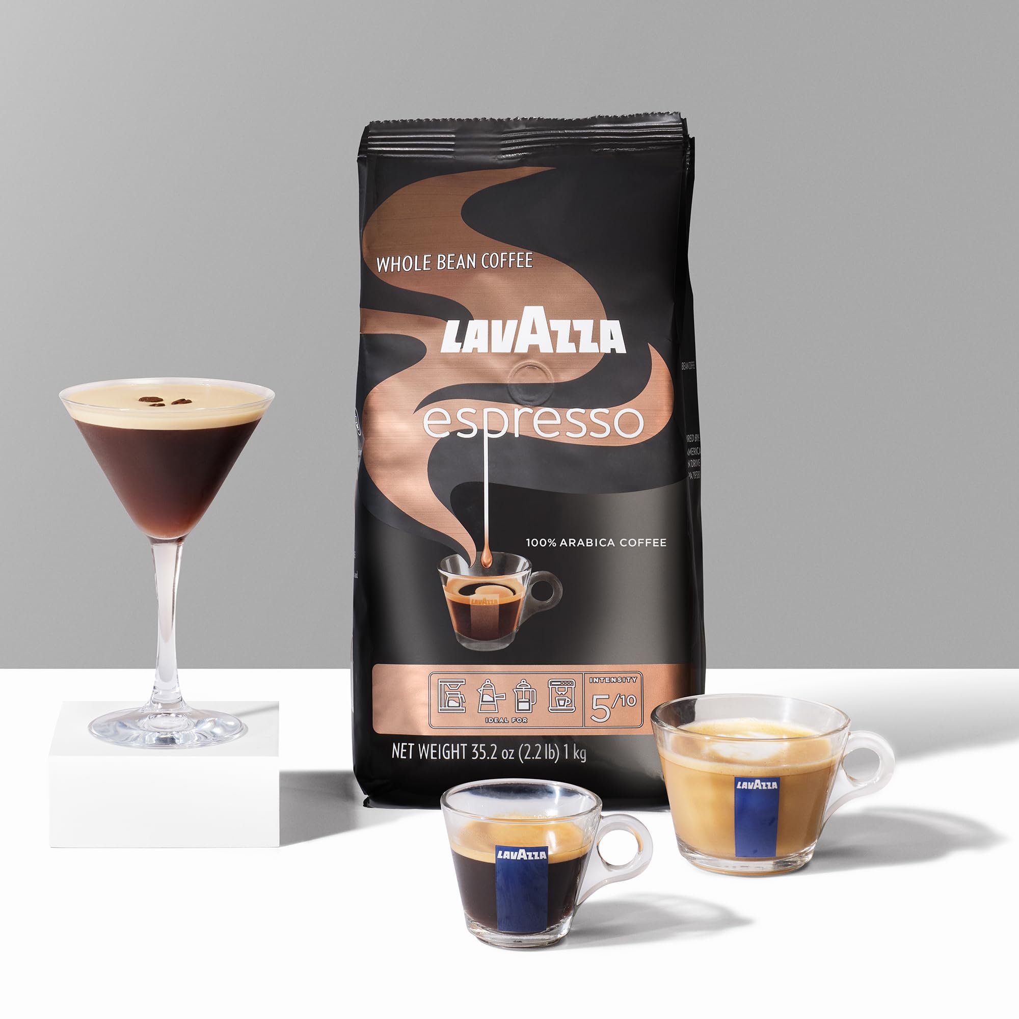 Lavazza brewed coffee poured from a French press showcasing rich cup clarity