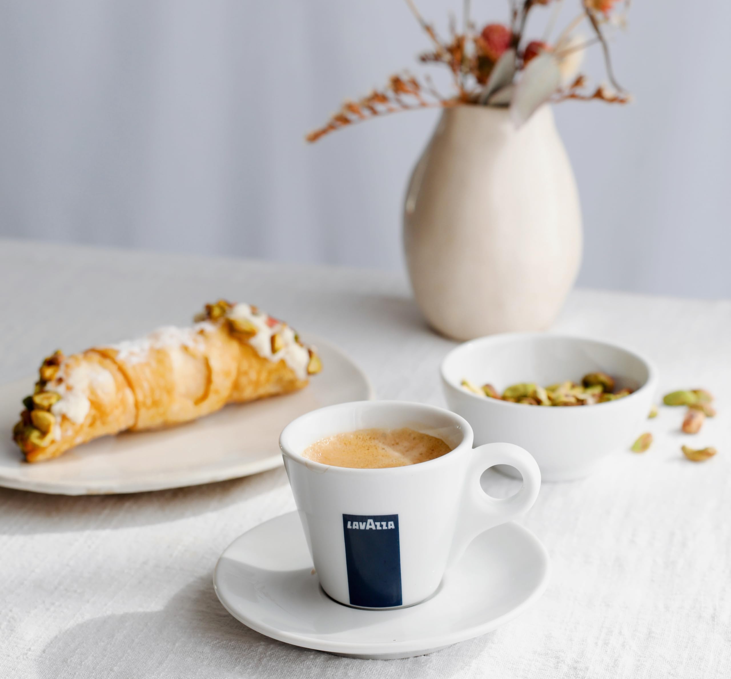 Opened Lavazza bag with beans visible emphasizing freshness and whole-bean format