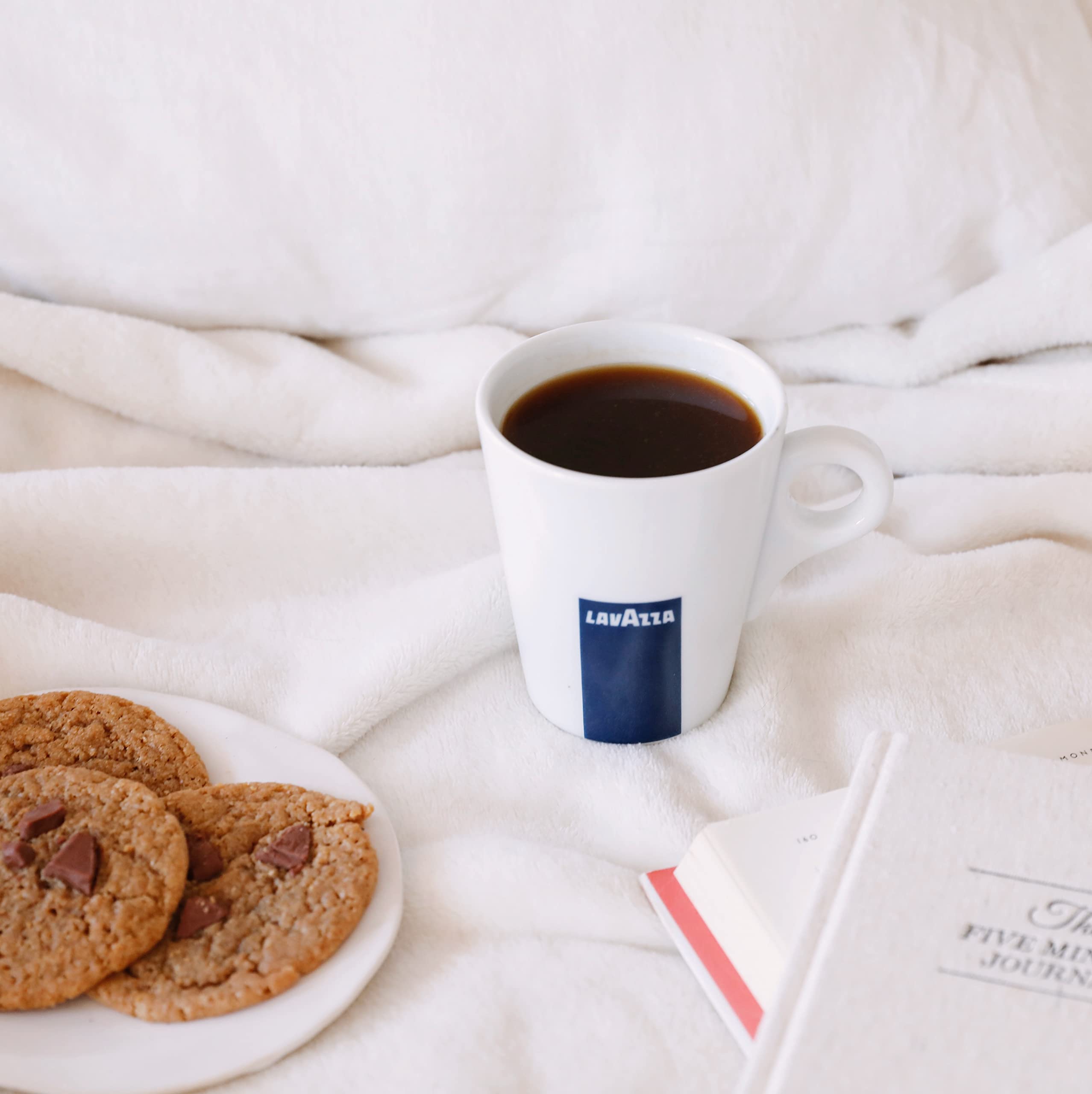 Morning table scene with Lavazza coffee illustrating lifestyle enjoyment and ritual