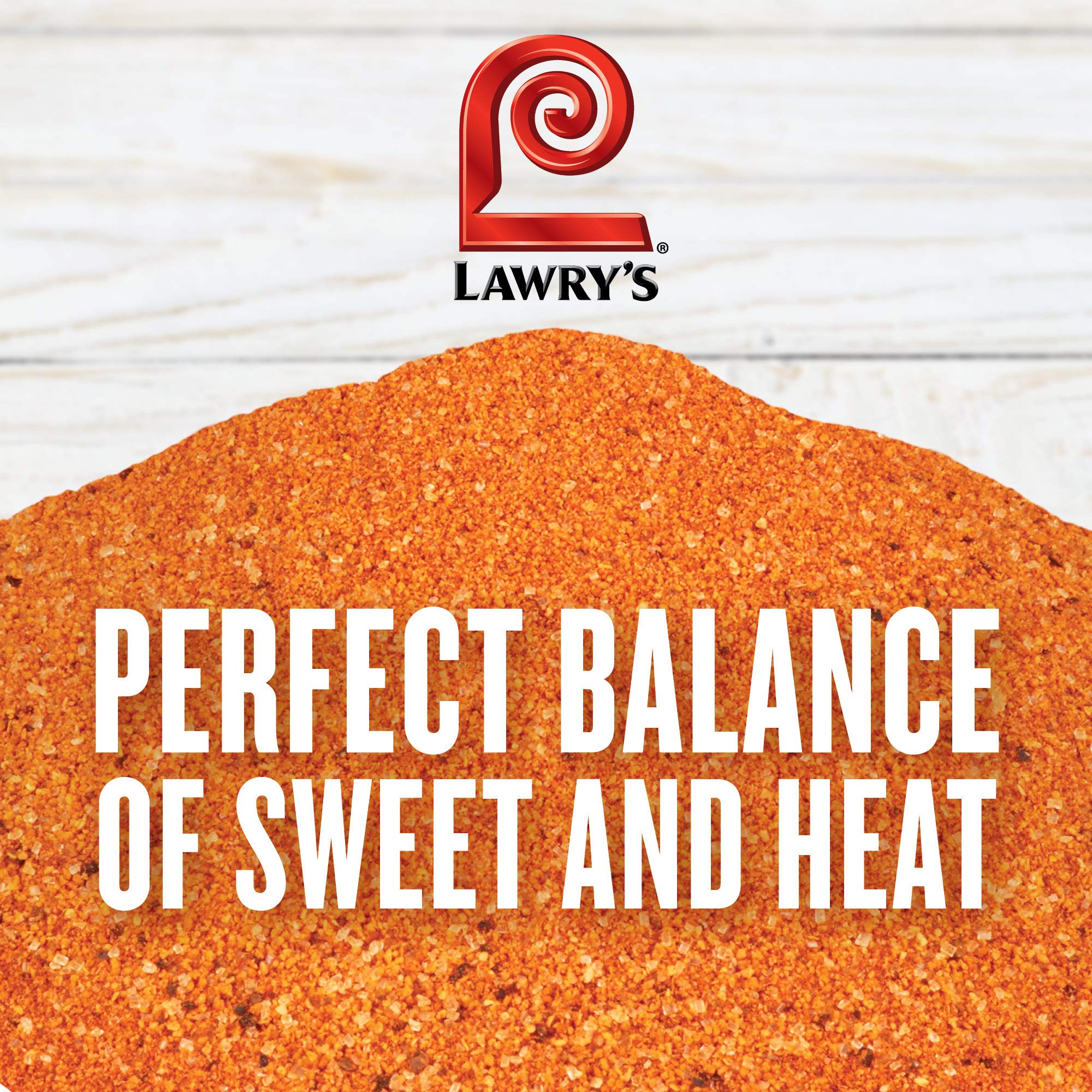 Lawry's rub being poured from container into spoon, illustrates easy dispensing and portion control