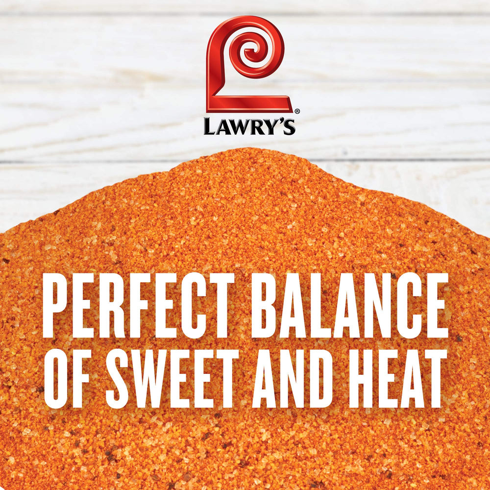 Lawry's rub being poured from container into spoon, illustrates easy dispensing and portion control