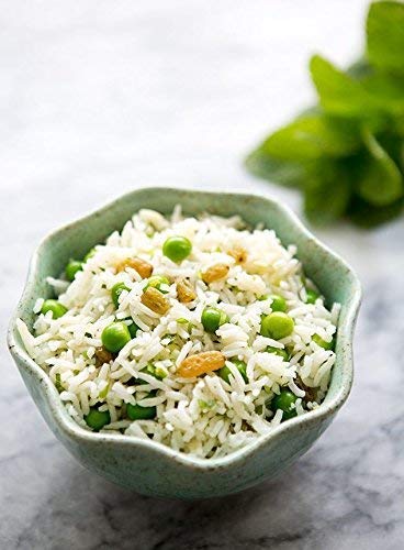 measuring cup with rice for accurate batter ratios, helping consistent idli results