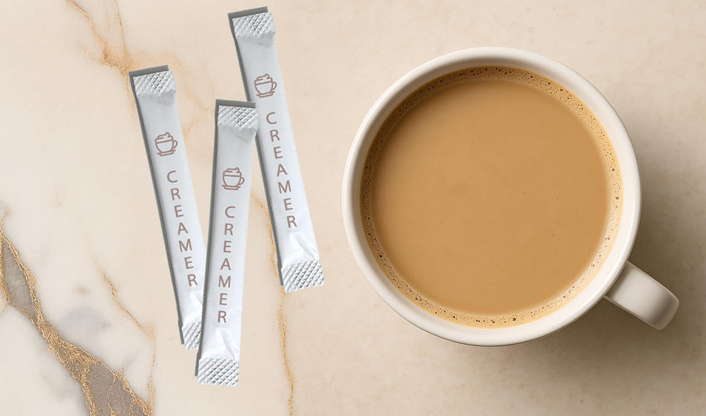Le Must creamer dissolving in hot coffee cup, showing smooth non-dairy whitening and fast blend