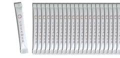 Le Must stick packet opened with powder visible, demonstrating easy single-serve portioning benefit