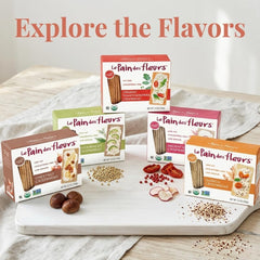Le Pain des Fleurs chestnut crispbread topped with cheese illustrating serving idea
