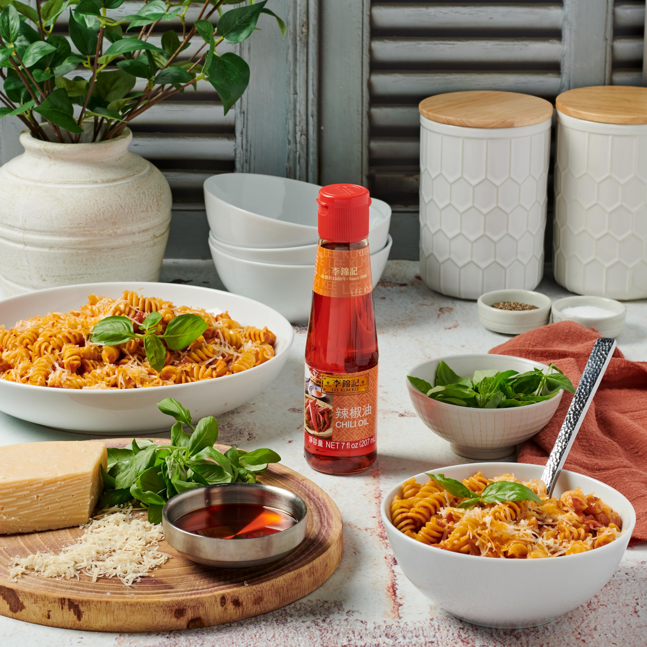 Lee Kum Kee jar beside fresh chilies and aromatics for cooking