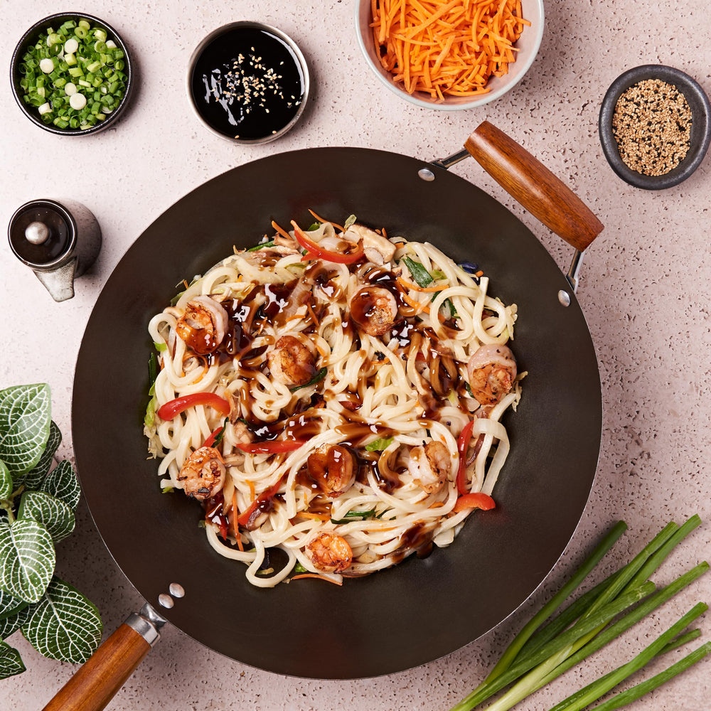 Wok stir-fry finished with Lee Kum Kee sauce giving glossy, even coating