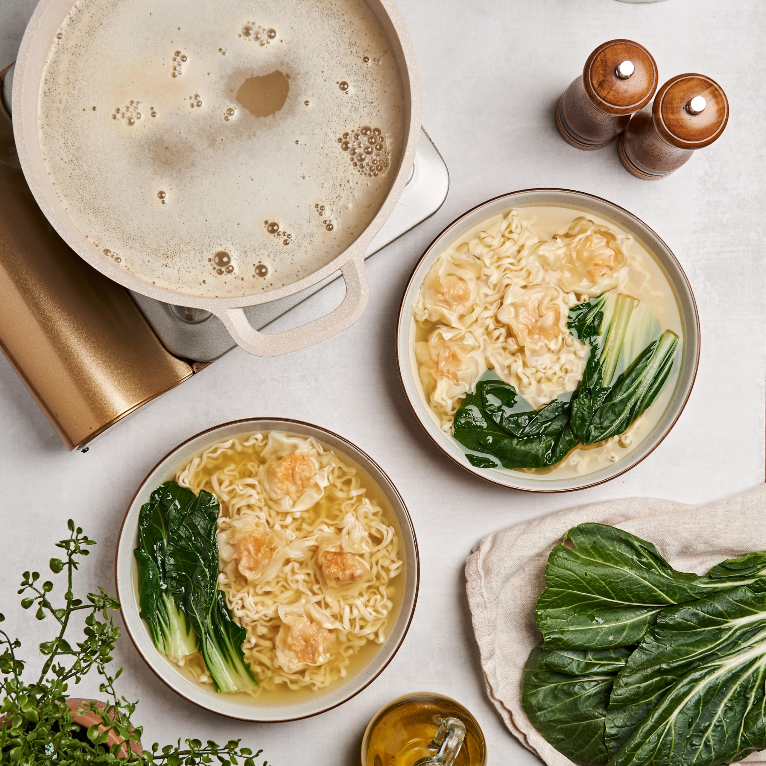 Lee Kum Kee pouring into soup pot to quickly create flavorful broth