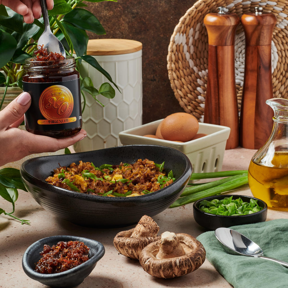 Lee Kum Kee XO Sauce stirred into a wok dish enhancing flavor and aroma