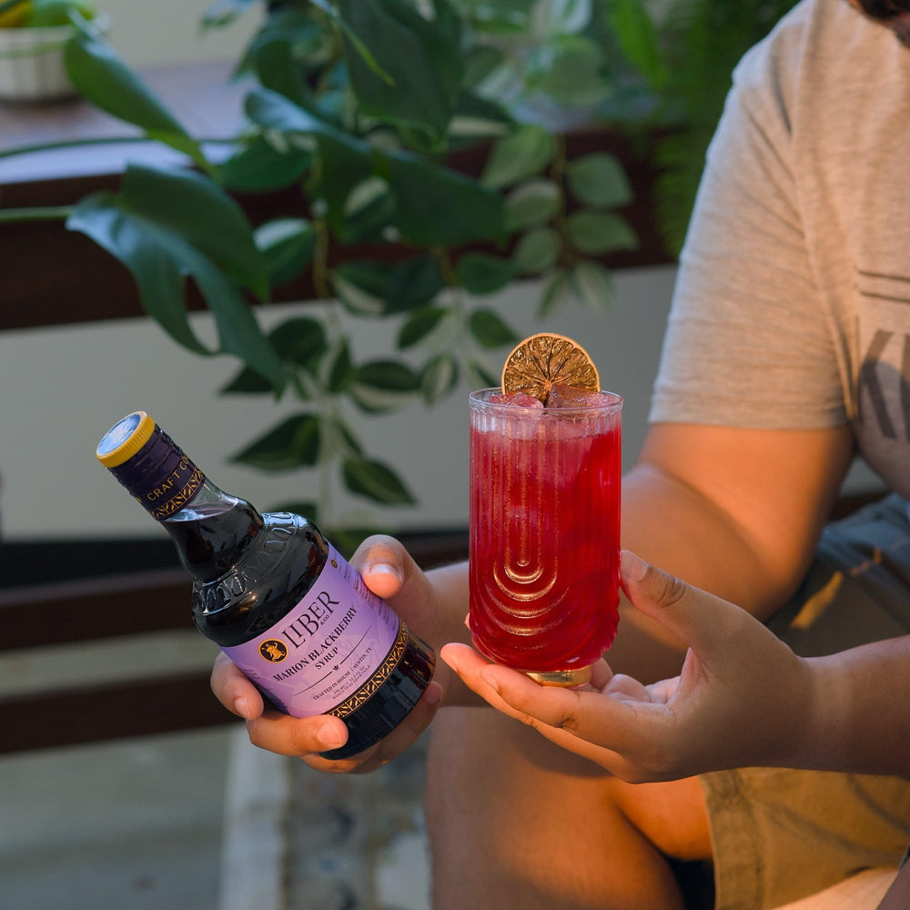 Finished bramble cocktail with Liber & Co. syrup garnished, showcasing drink enhancement