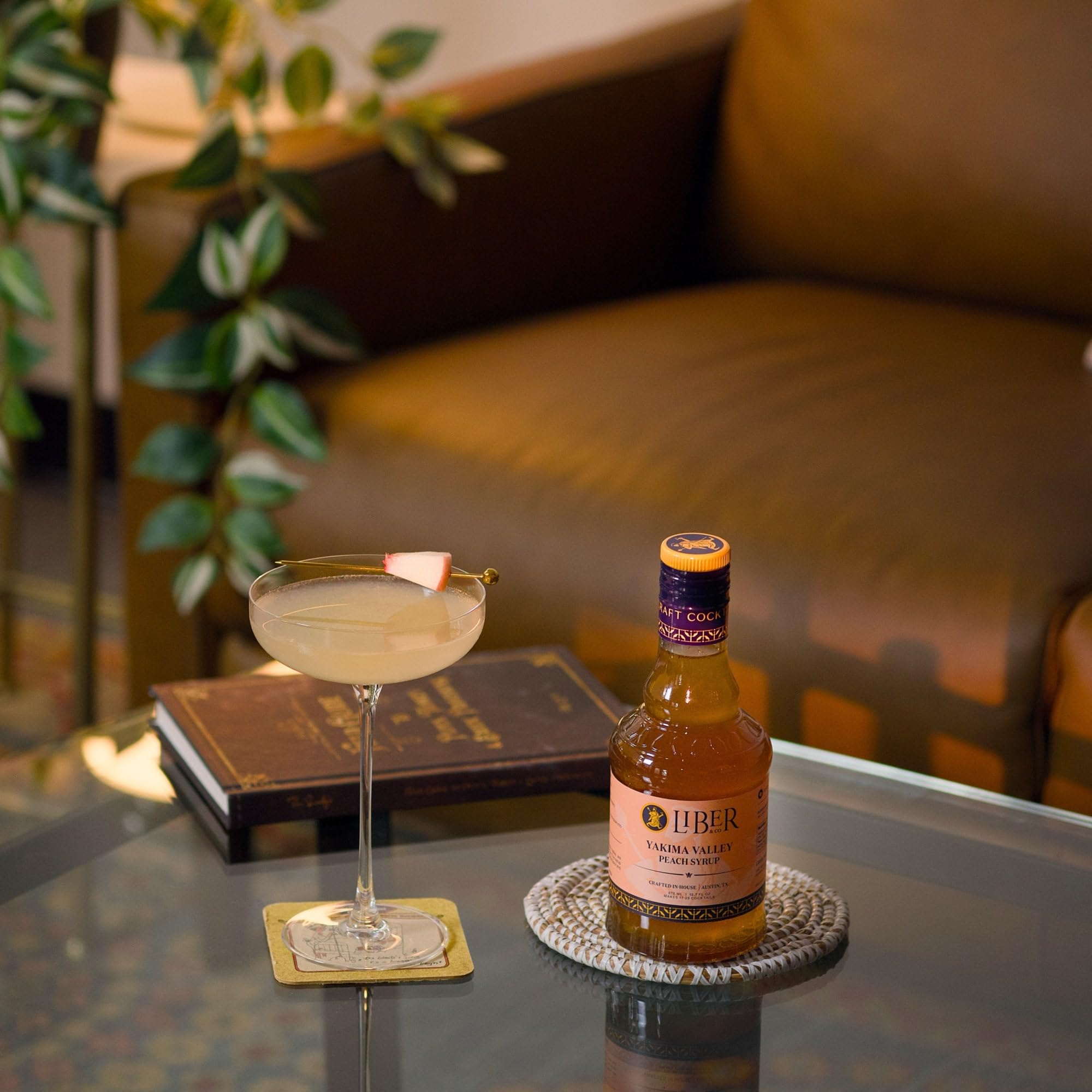 Liber & Co. syrup being poured into a mixing glass for efficient cocktail prep