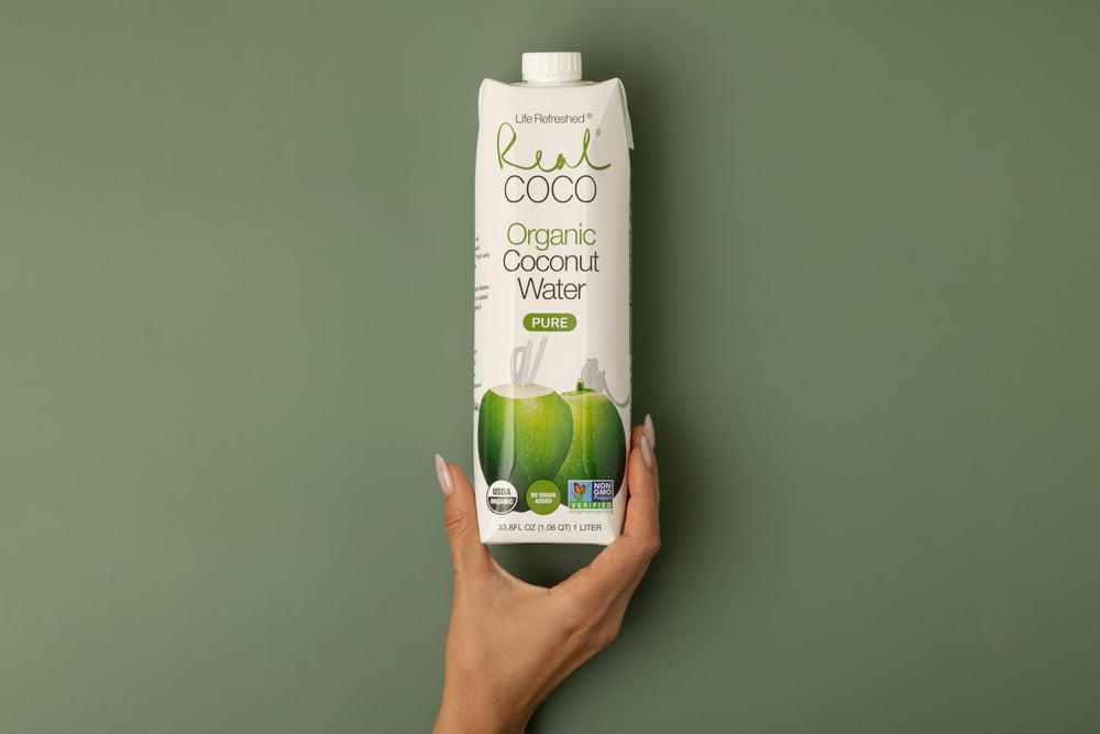 Life Refreshed 1L carton beside a water bottle for scale and convenience