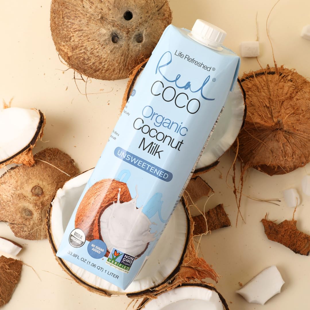 Life Refreshed Real Coco next to coconut and fruit for scale