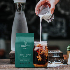Lifeboost bag opened pouring beans into scoop showing freshness preserved