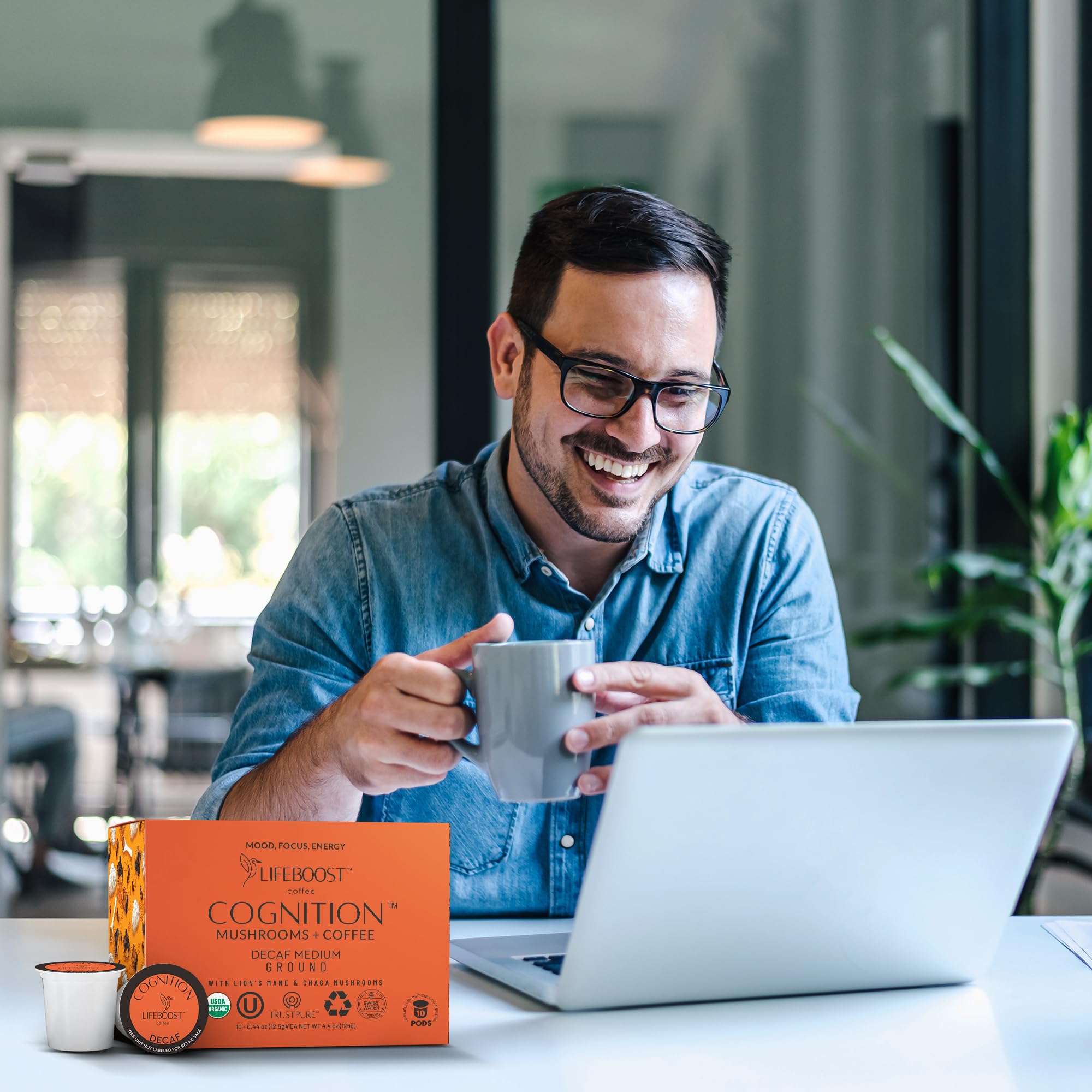 Lifestyle scene of Lifeboost pod by laptop for focused home work sessions