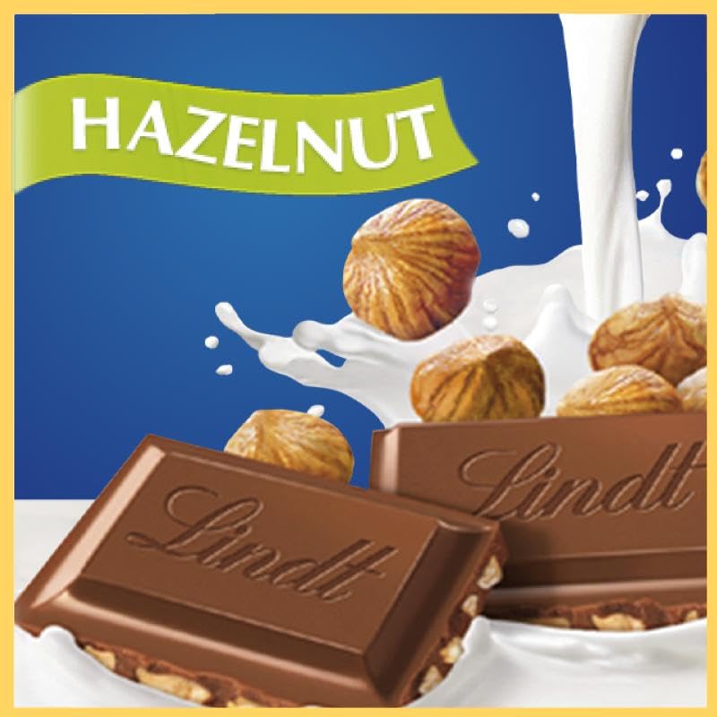 Lindt close-up of roasted hazelnut pieces in chocolate, adds crunchy texture