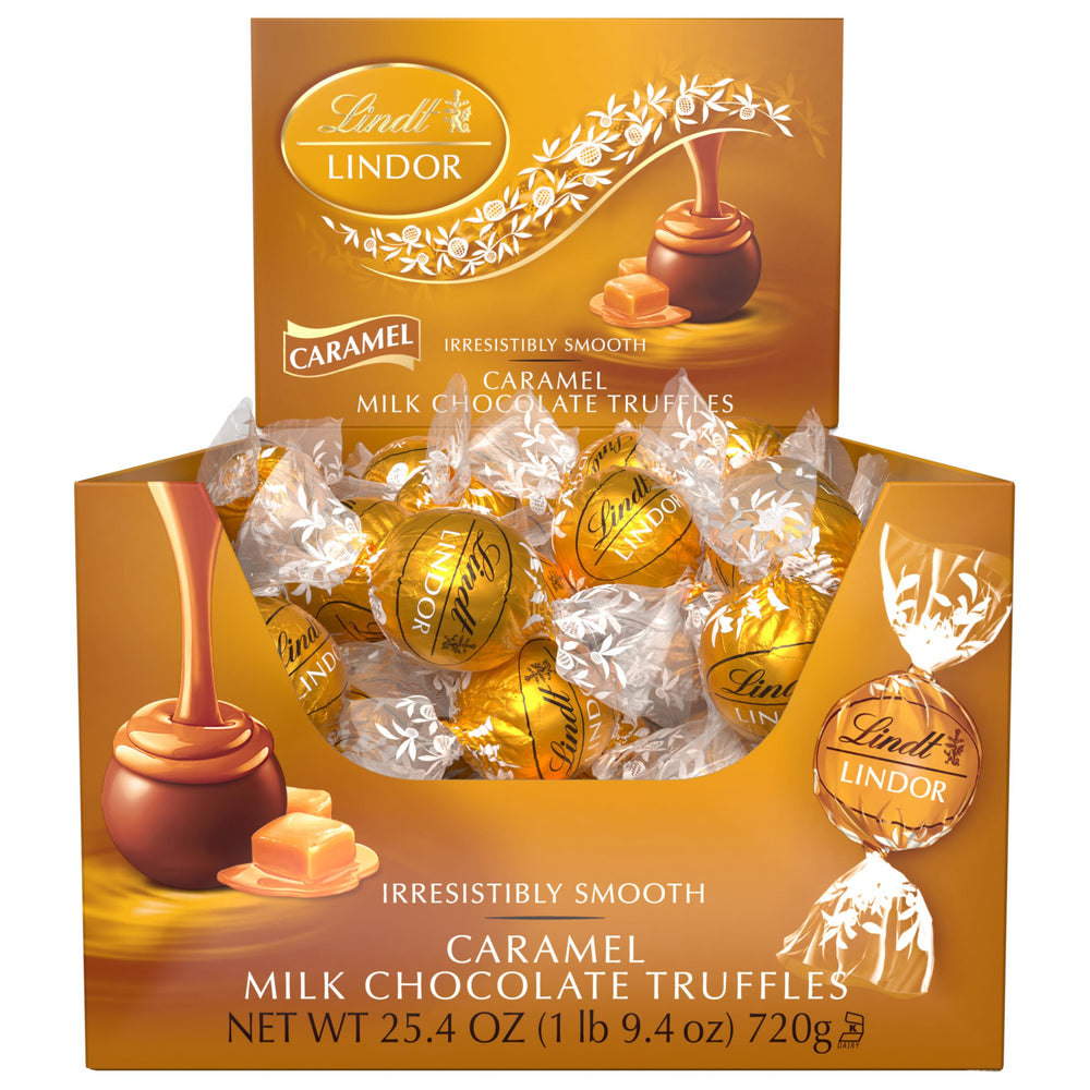 Lindt LINDOR truffles beside coffee in a cozy setting for pairing enjoyment