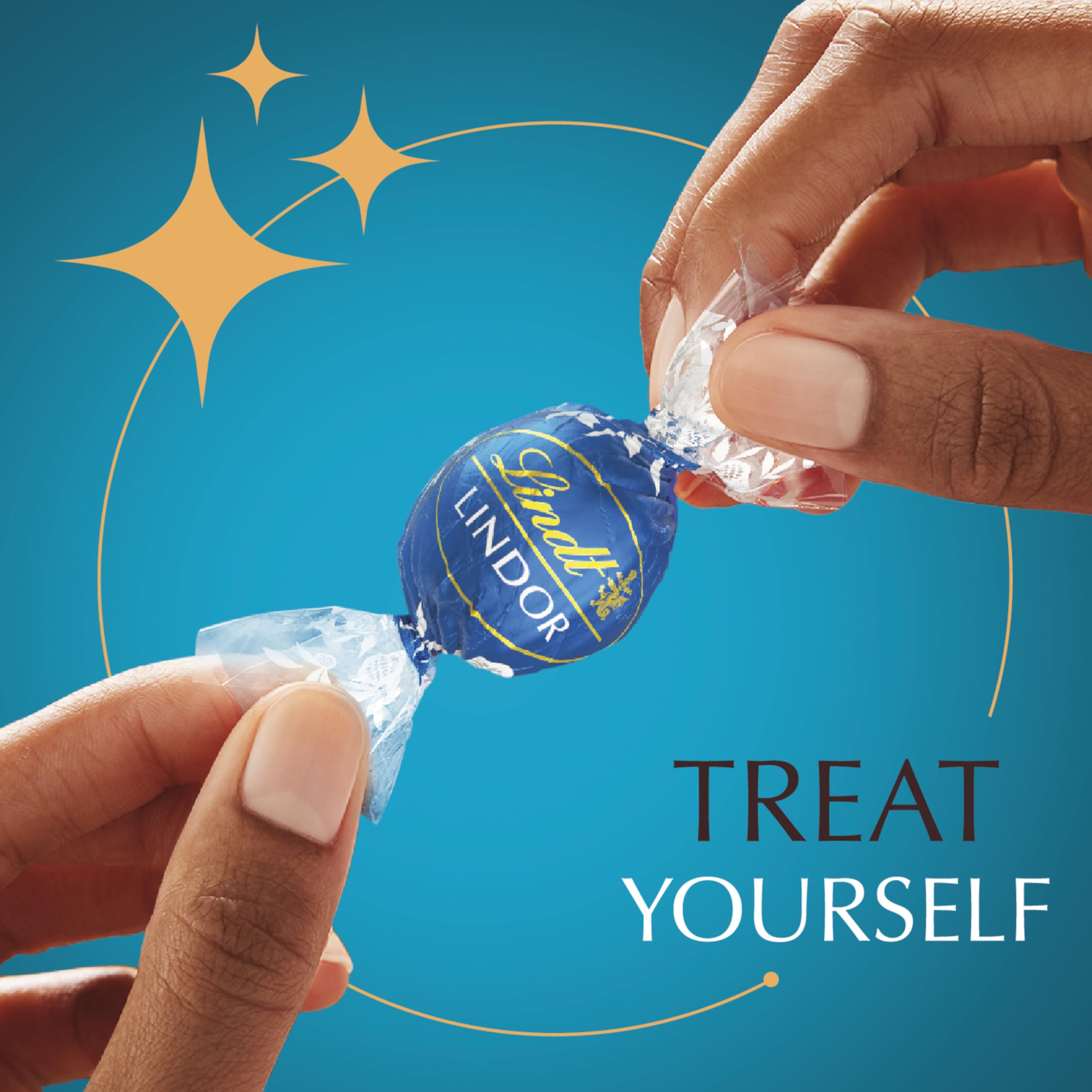 Lindt LINDOR truffle in hand for scale illustrating generous portion and gifting suitability