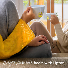 Lipton chai pouring into cup with milk and spices highlighting compatibility for rich, comforting tea