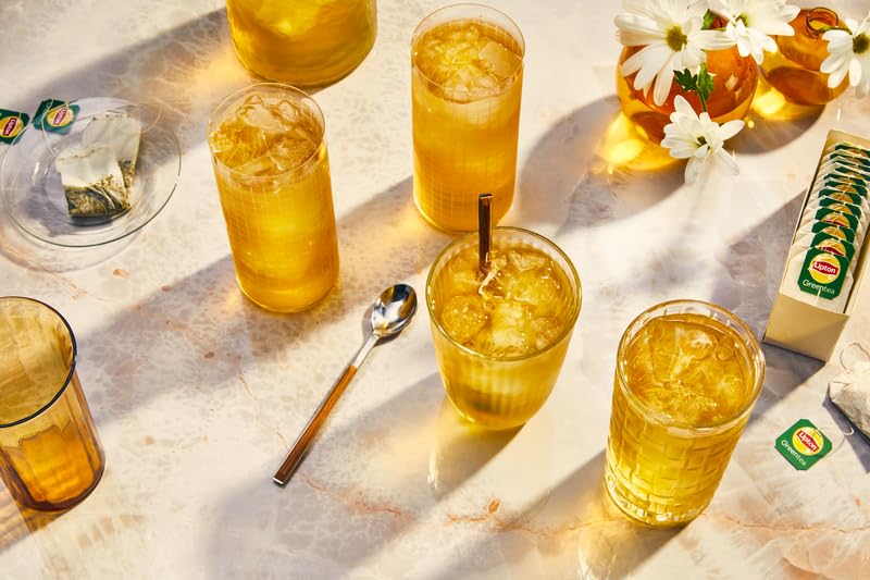 Lipton served in cup with steam rising, demonstrates delicate jasmine aroma