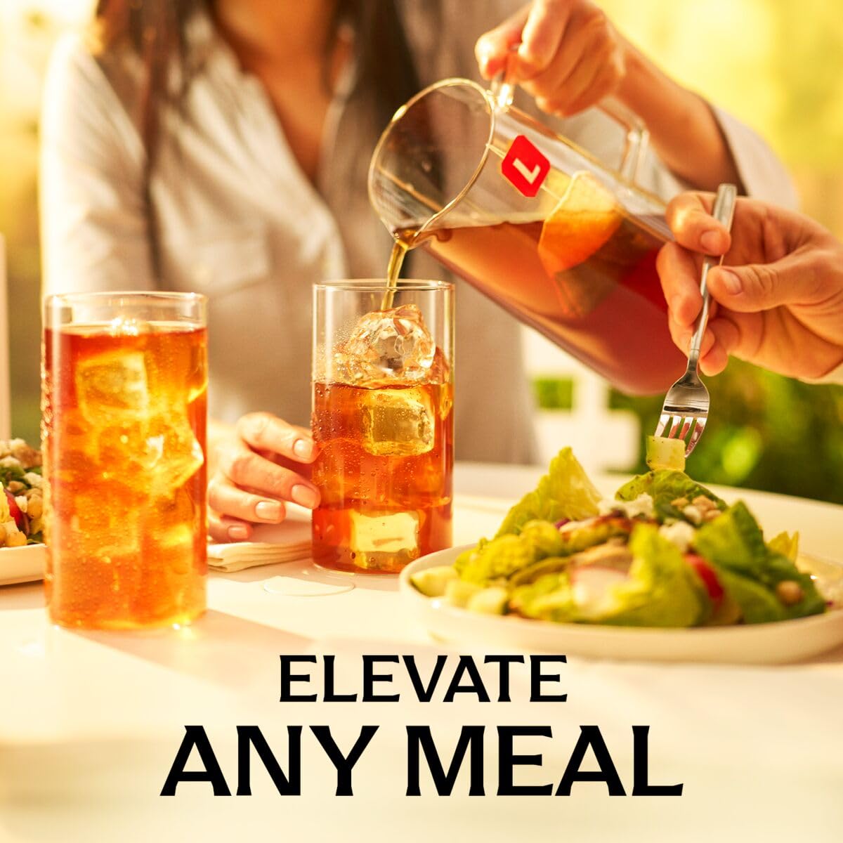 Pouring Lipton Southern Sweet tea into a glass showing smooth refreshing pour