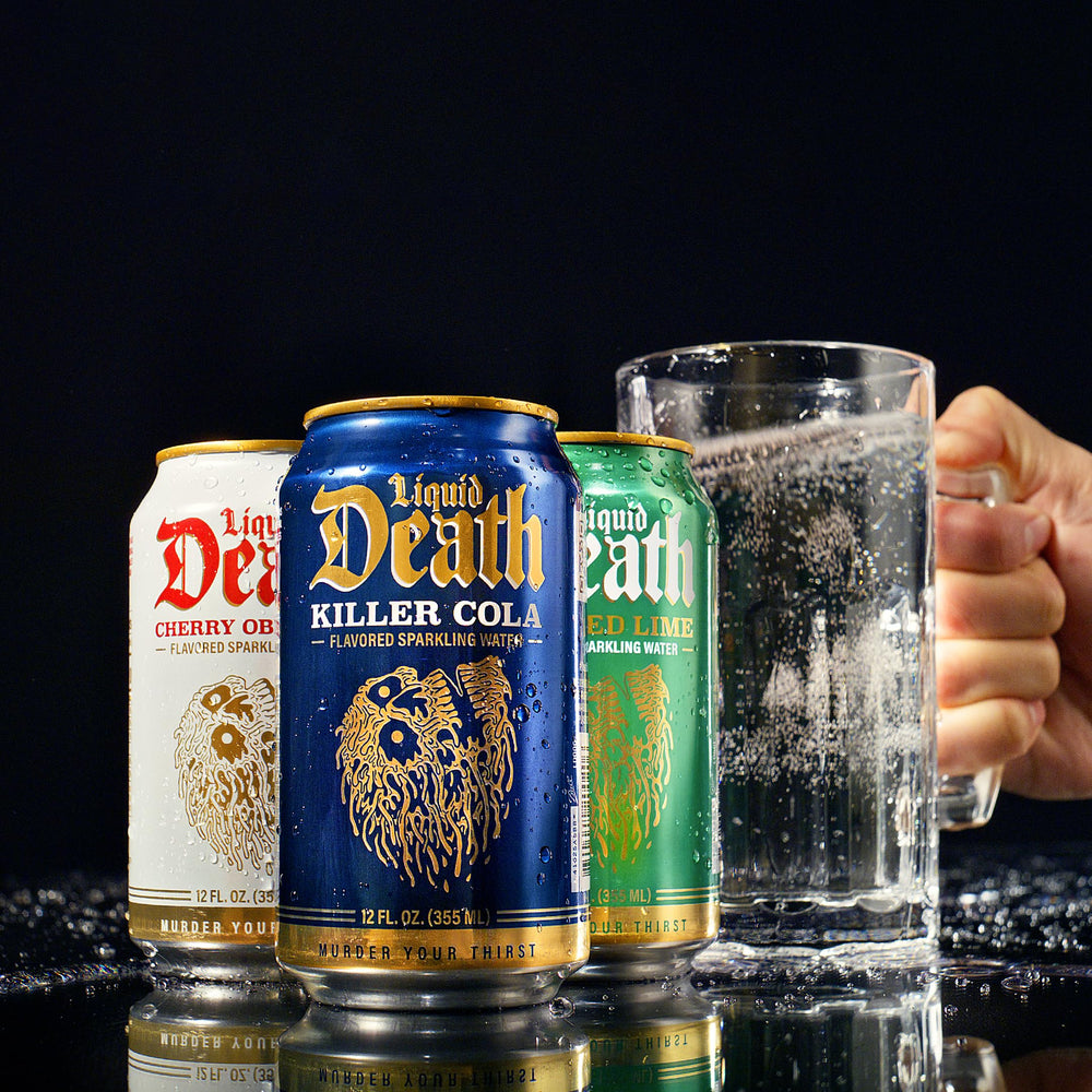 Liquid Death served over ice in a glass highlighting refreshing carbonation and cola flavor