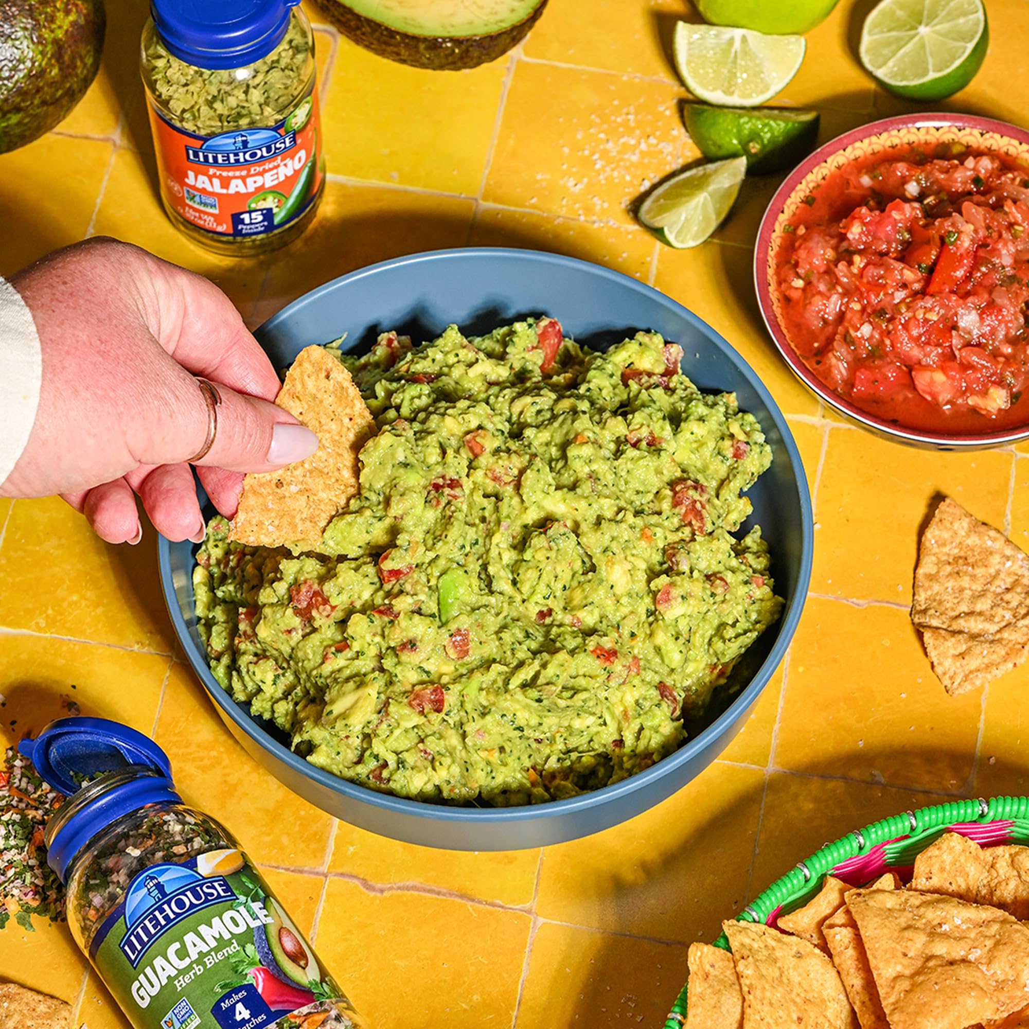 Spoonful of Litehouse seasoning measured over avocado illustrating easy portioning